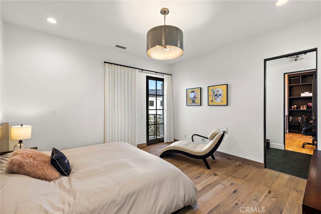 12 Thomas Road Ladera Ranch, CA 92694 - Photo 44 of 70 a bedroom with a bed and a chandelier