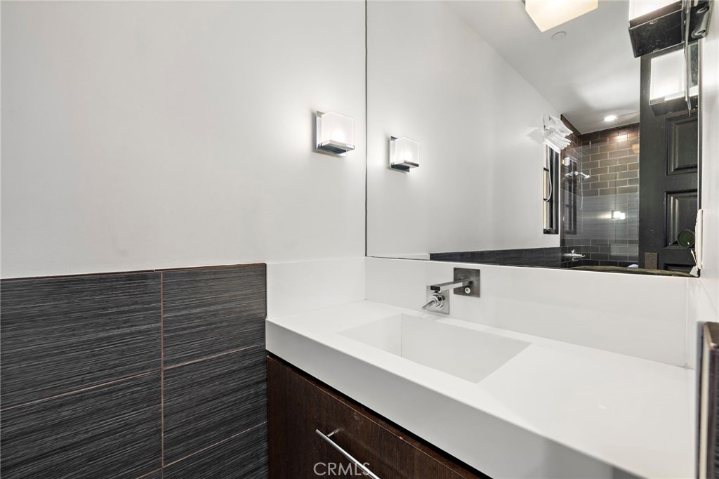 12 Thomas Road Ladera Ranch, CA 92694 - Photo 47 of 70 a bathroom with a sink and a mirror