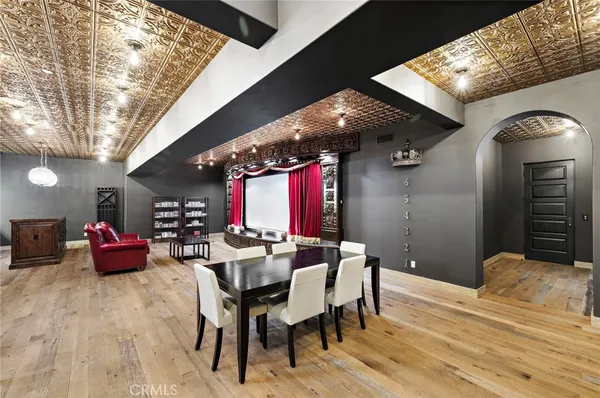 an aerial view of a house with a swimming pool and outdoor seating