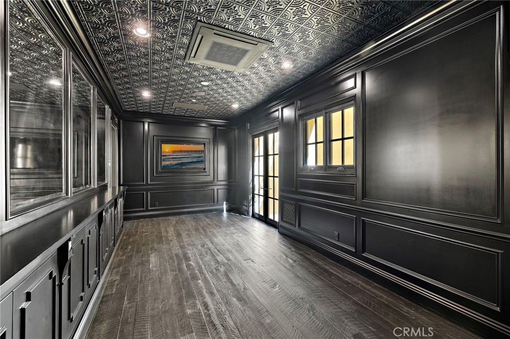 12 Thomas Road Ladera Ranch, CA 92694 - Photo 53 of 70 a view of an empty room with wooden floor and windows