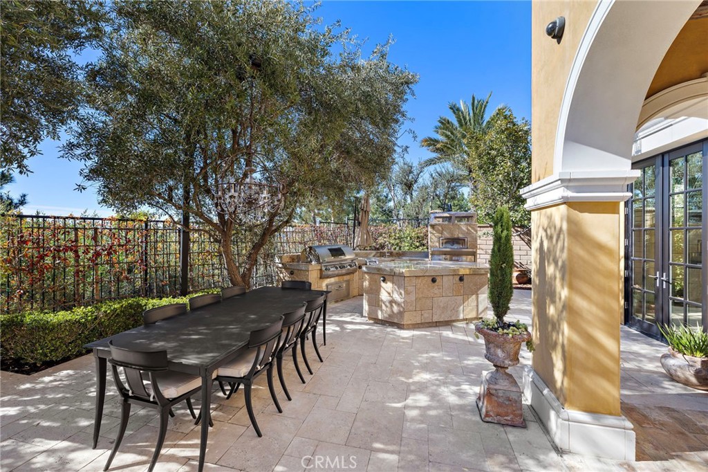 12 Thomas Road Ladera Ranch, CA 92694 - Photo 63 of 70 a view of a patio with table and chairs and potted plants