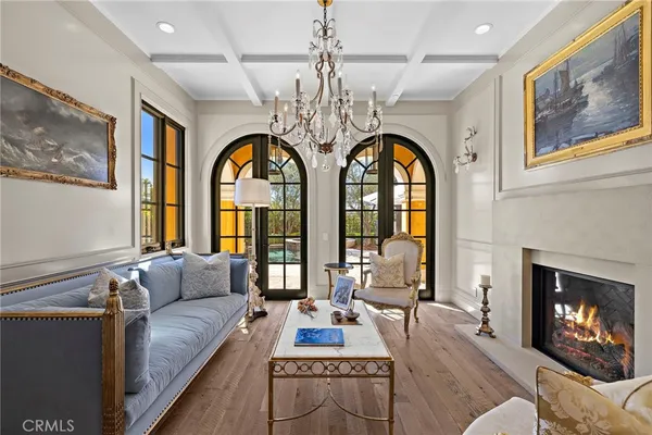 a view of a dining room with furniture wooden floor and chandelier