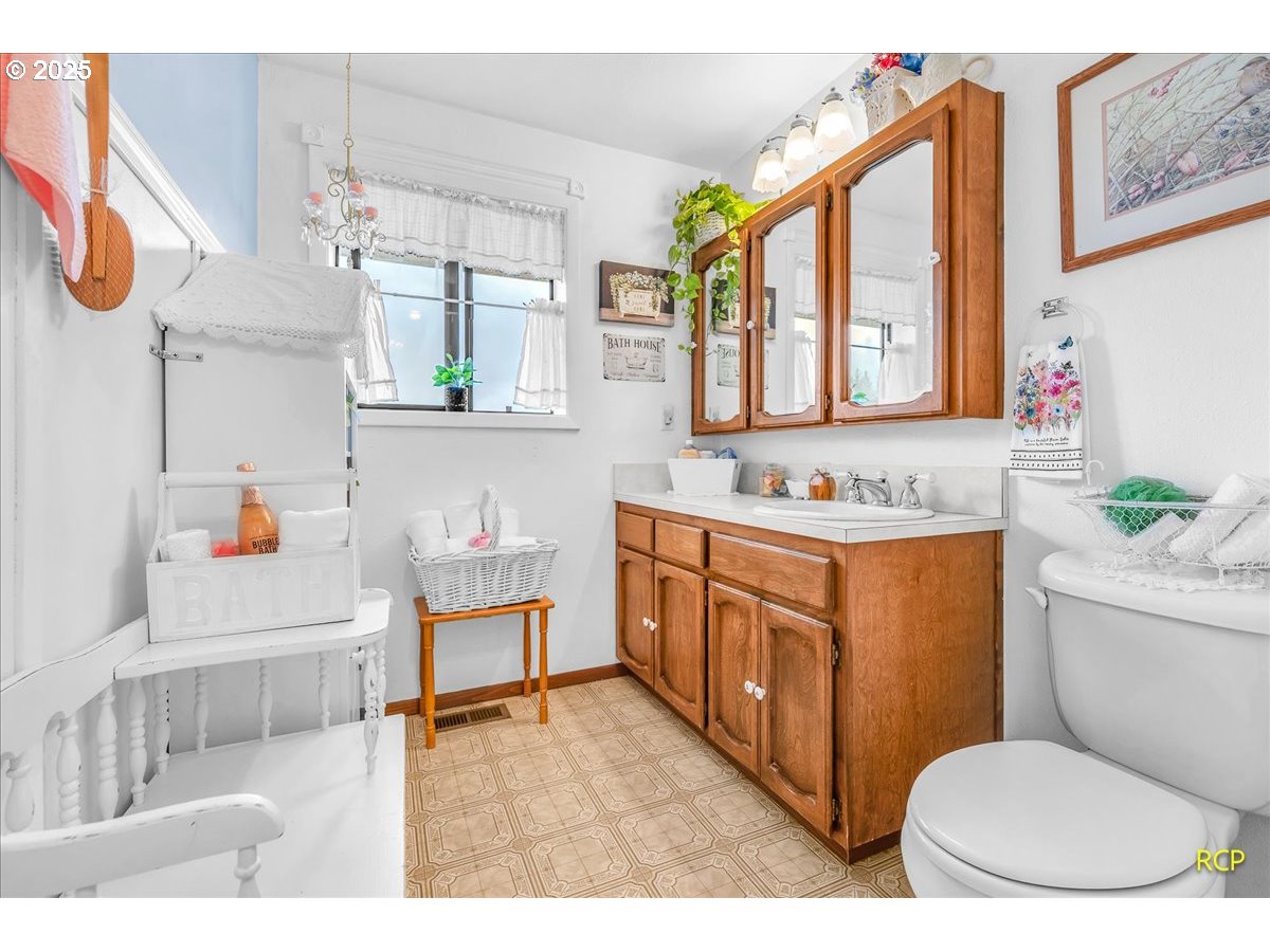 24312 Cardwell Hill Drive Philomath, OR 97370 - Photo 26 of 48 a bathroom with a sink a vanity and a mirror