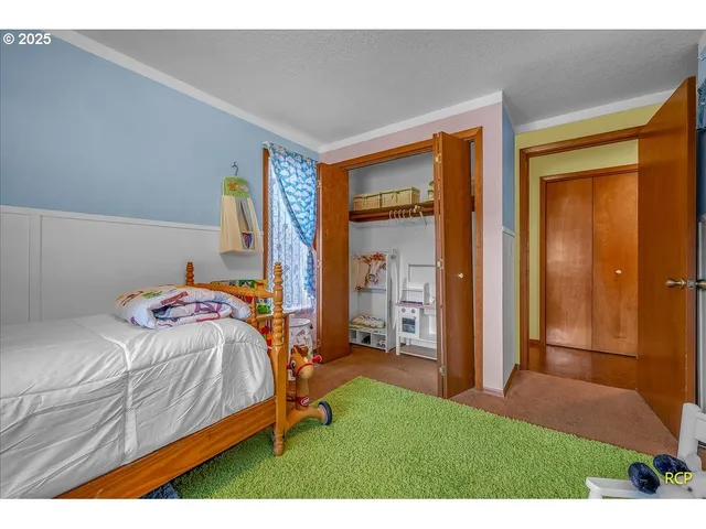 a bedroom with a bed and a closet