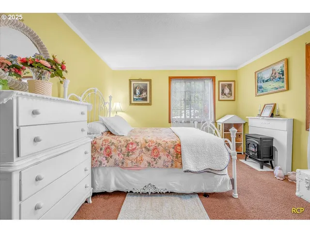 a bedroom with a bed and a dresser