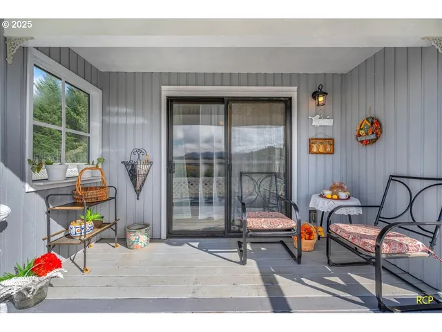 a living room filled with furniture and a window