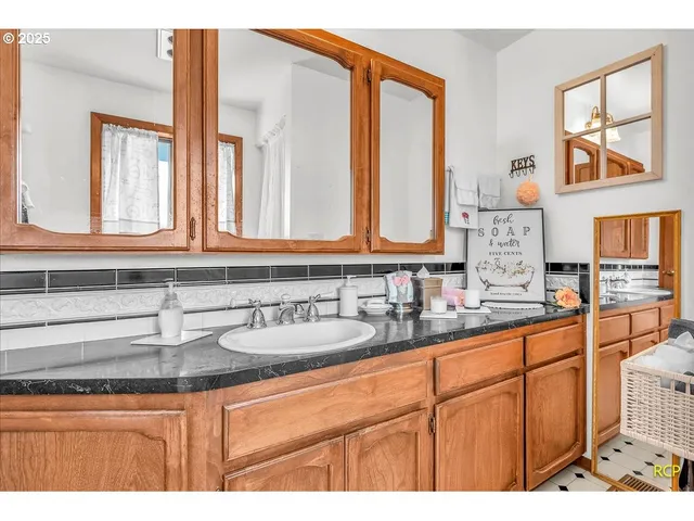 a bathroom with sink and mirror