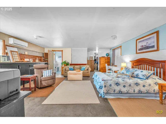 a living room with furniture and a lamp