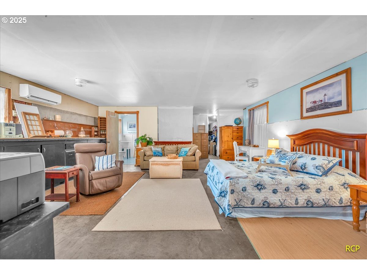 24312 Cardwell Hill Drive Philomath, OR 97370 - Photo 40 of 48 a living room with furniture and a lamp