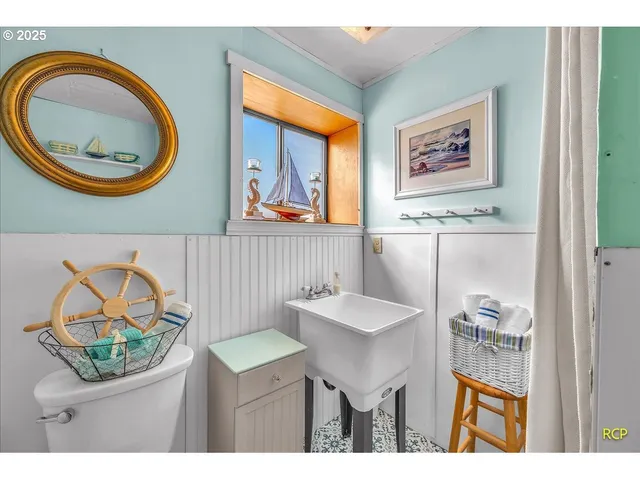 a bathroom with a sink a mirror and a window