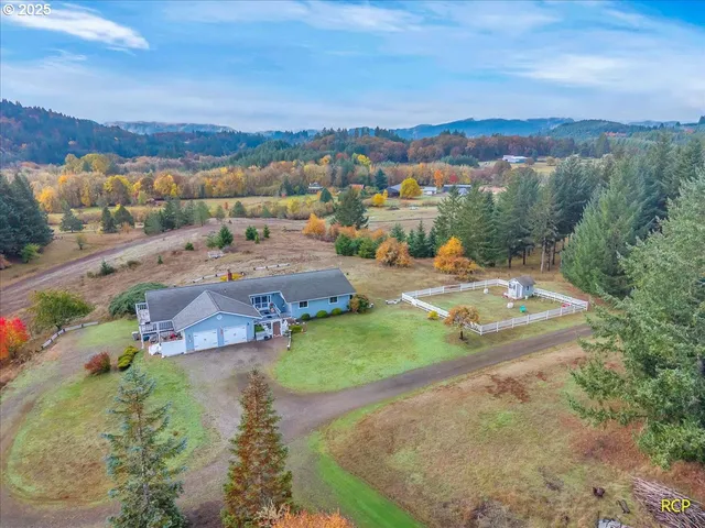 an aerial view of a house with outdoor space