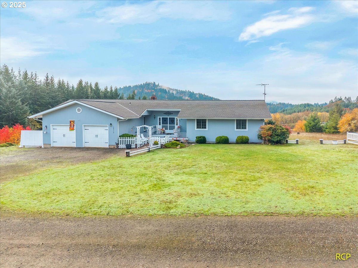 24312 Cardwell Hill Drive Philomath, OR 97370 - Photo 5 of 48 a swimming pool is sitting in front of house