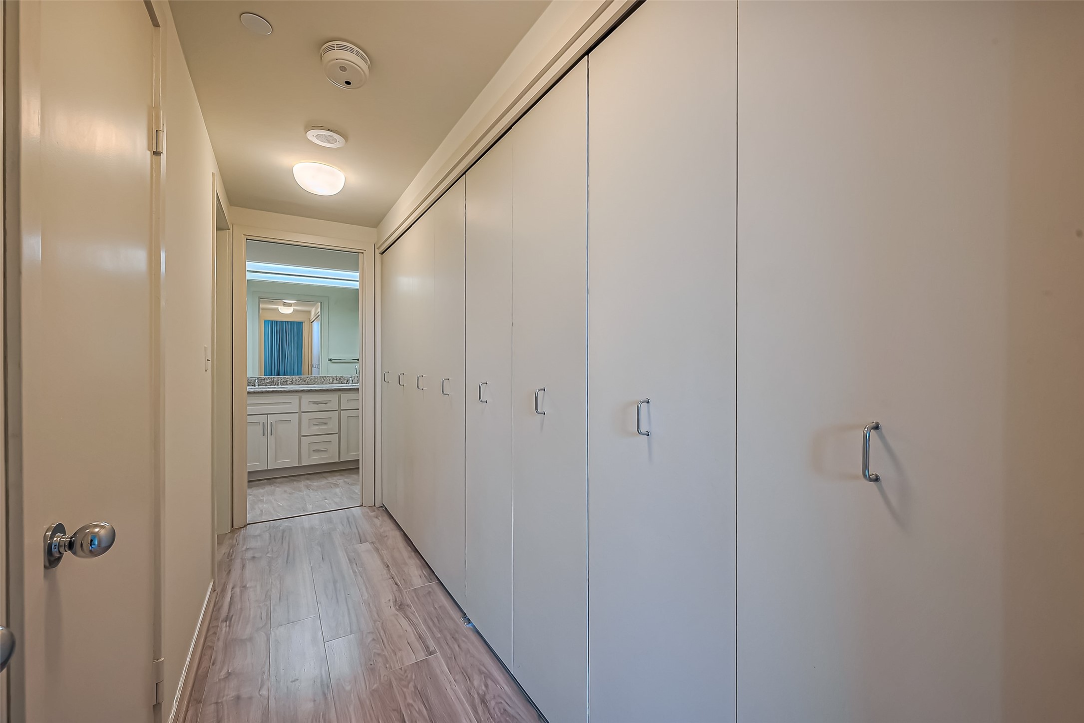 5100 San Felipe Street, Unit 34 Houston, TX 77056 - Photo 16 of 26 a view of a hallway with wooden floor