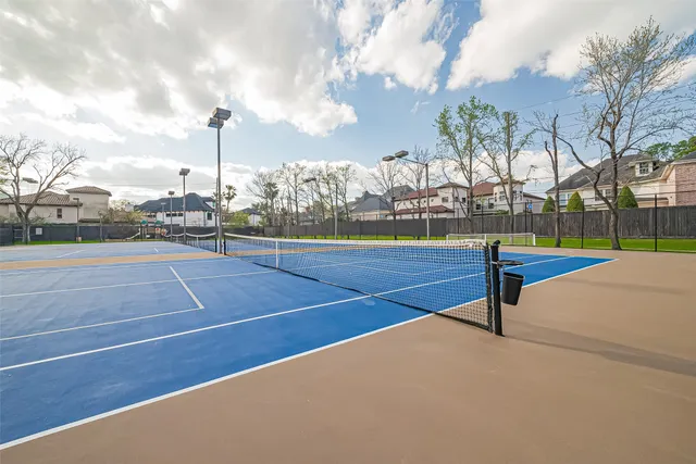 a swimming pool with outdoor seating