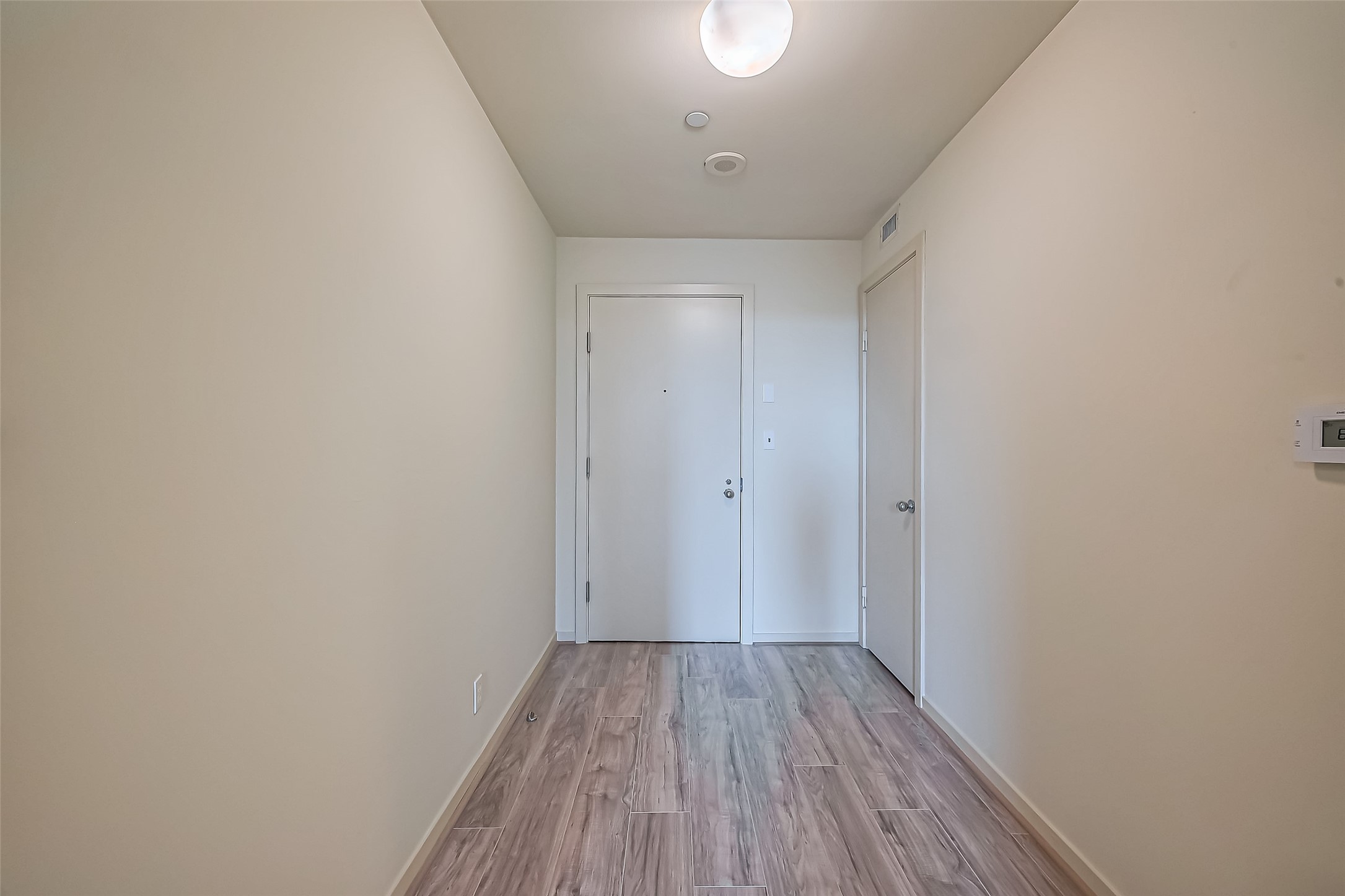 5100 San Felipe Street, Unit 34 Houston, TX 77056 - Photo 3 of 26 a view of a room with wooden floor