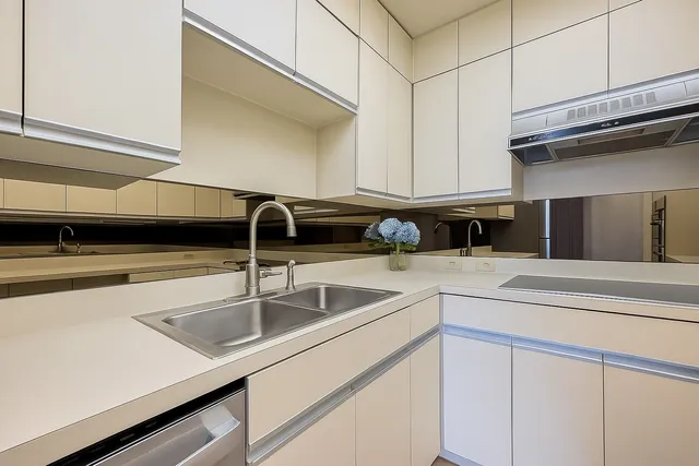 a kitchen with a sink and cabinets