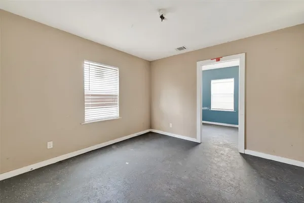 a bathroom with a sink a toilet a mirror and vanity