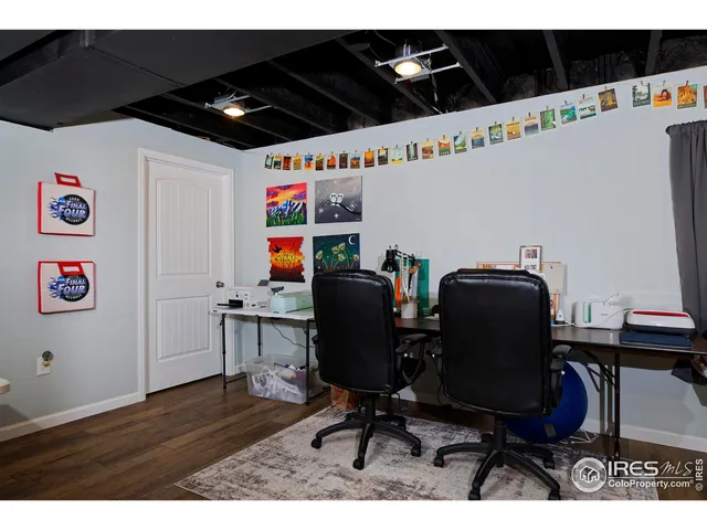 a view of workspace with wooden floor