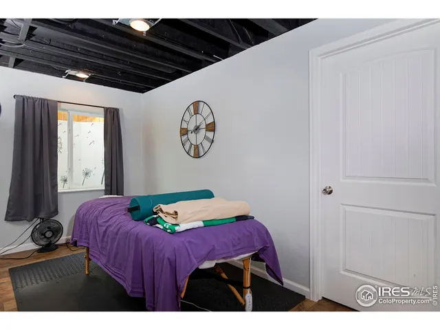 a bedroom with a bed and a closet