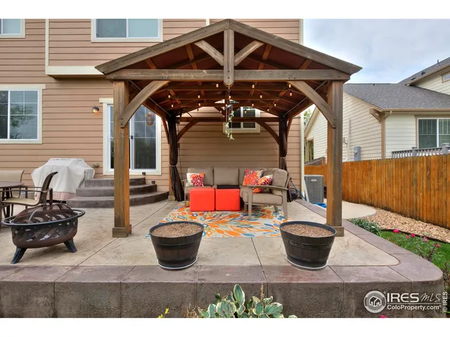 a view of a chairs and table in the patio