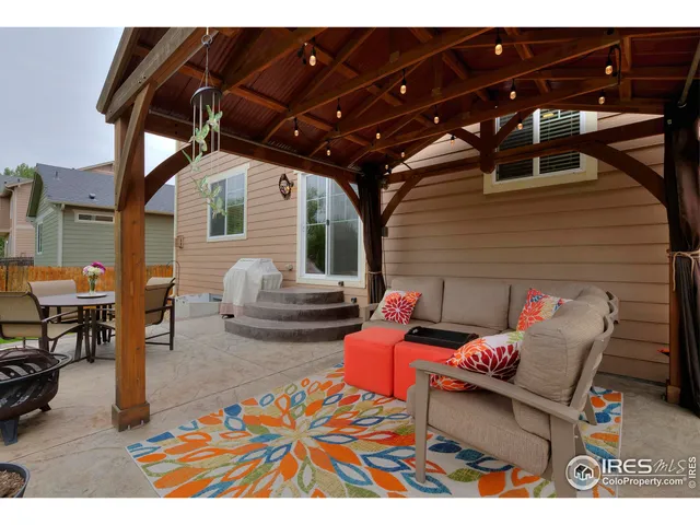 a outdoor space with the couches and dining table with the outer view