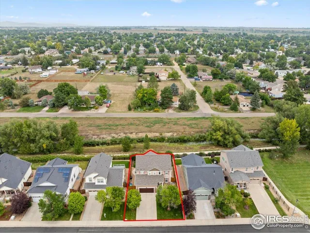 an aerial view of residential building with outdoor space and lake view