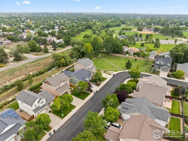 an aerial view of a city with lots of residential buildings