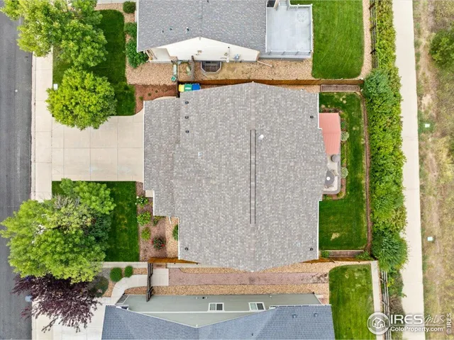 an aerial view of a house with a garden