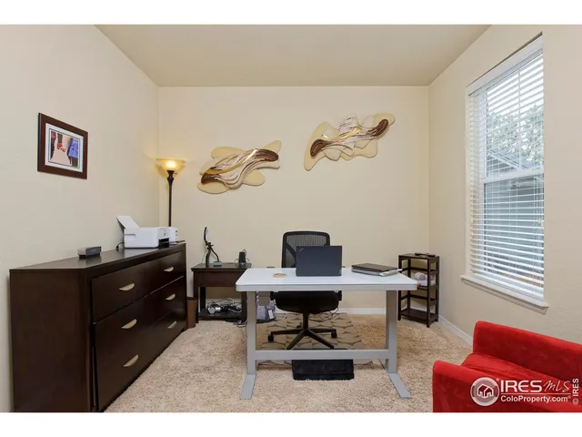 a view of a workspace with furniture