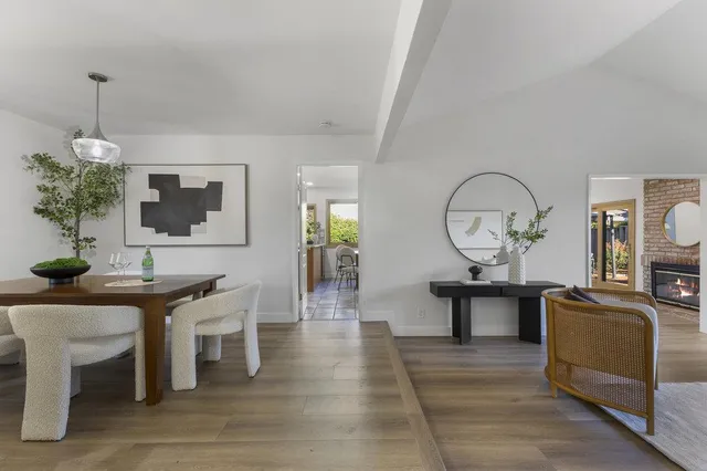 a kitchen with sink and large window
