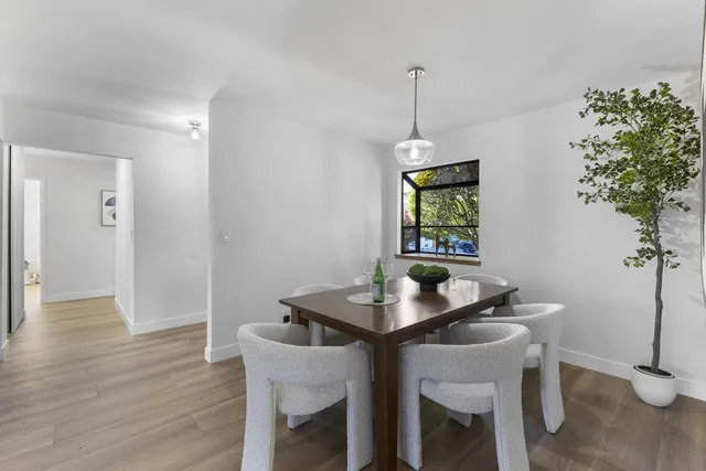 a kitchen with stainless steel appliances granite countertop a sink and a stove top oven