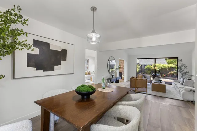 a bathroom with a toilet a sink and a large mirror