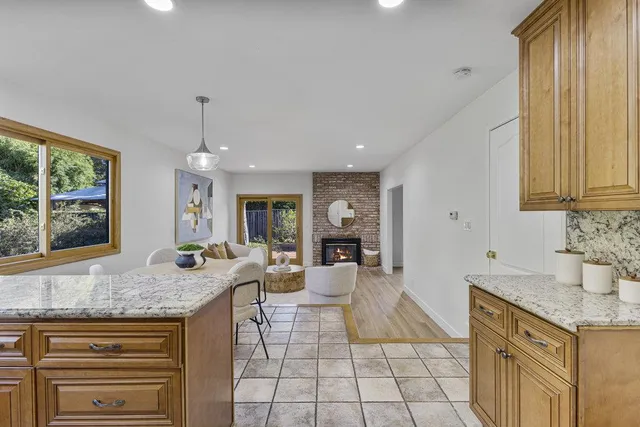 a bedroom with two beds and a chandelier