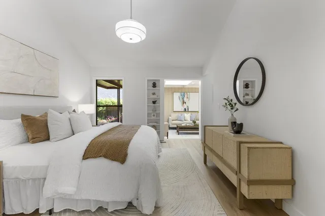 a view of a backyard with wooden fence