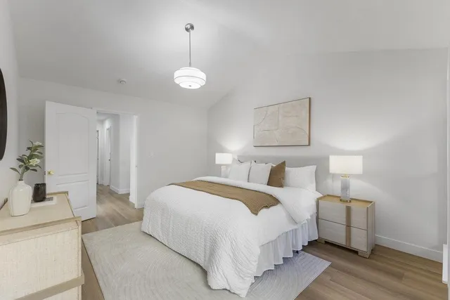 a view of a backyard with plants and outdoor seating