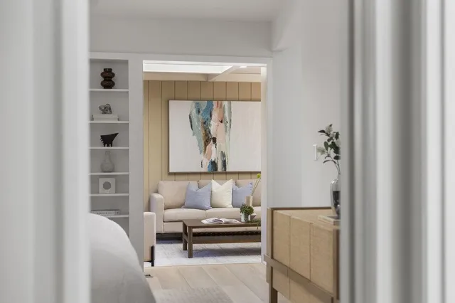 a view of a patio with table and chairs and potted plants