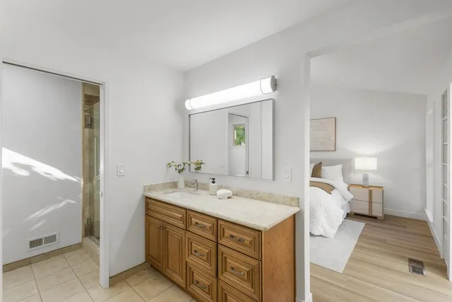 a view of a patio with a table chairs and a umbrella