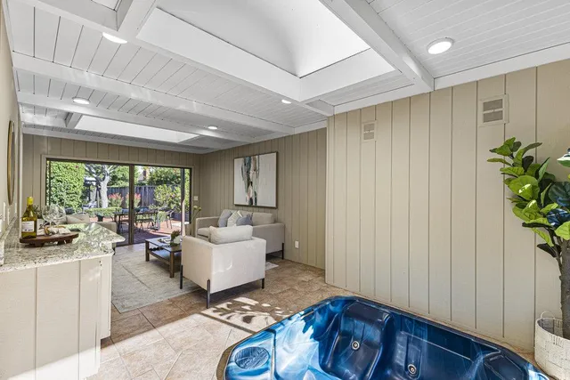 a view of a backyard with wooden fence