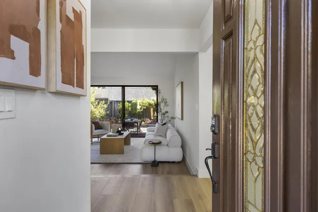 a living room with fireplace furniture and a flat screen tv