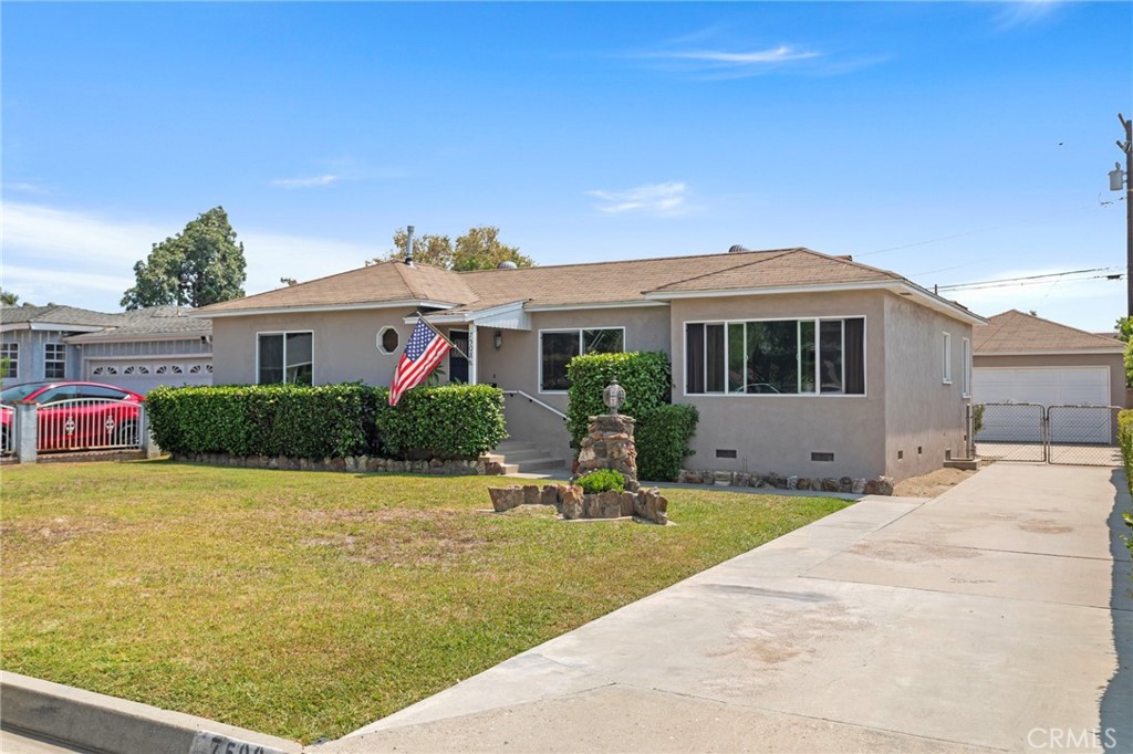 7508 Brookmill Road Downey, CA 90241 - Photo 1 of 29 a front view of a house with a yard