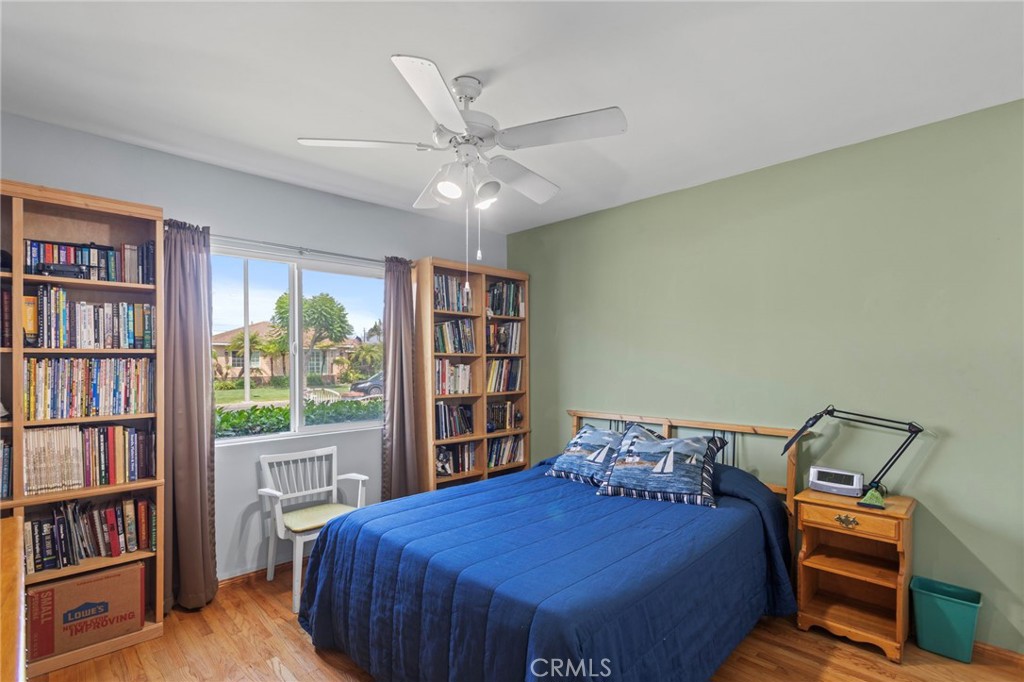 7508 Brookmill Road Downey, CA 90241 - Photo 18 of 29 a bedroom with a bed and a book shelf