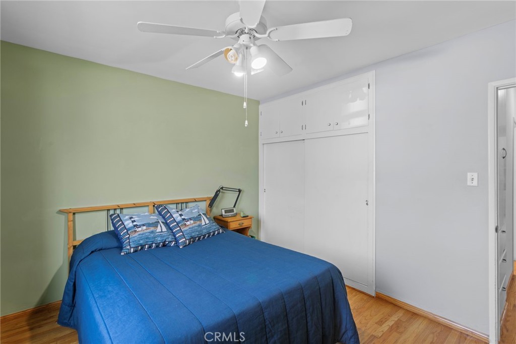 7508 Brookmill Road Downey, CA 90241 - Photo 19 of 29 a bedroom with a bed and a chandelier