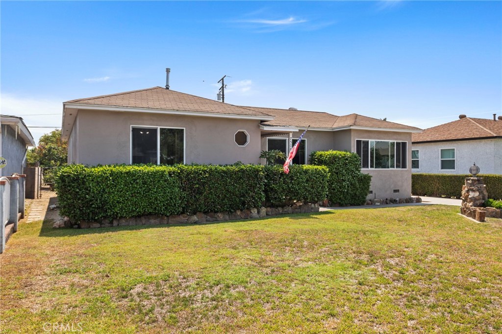 7508 Brookmill Road Downey, CA 90241 - Photo 2 of 29 a front view of a house with yard and porch