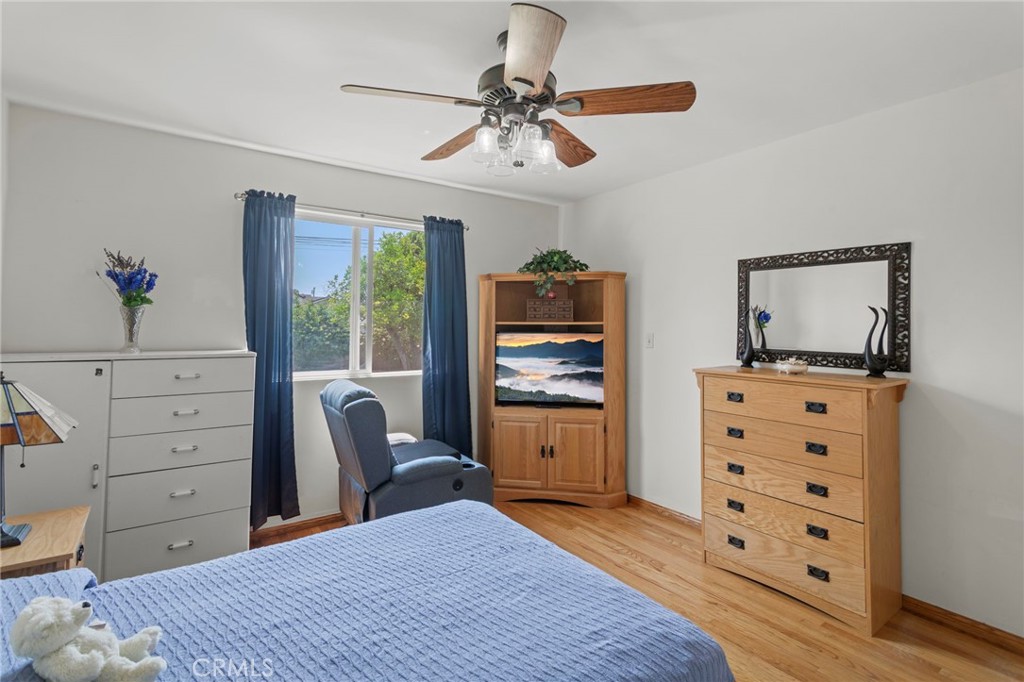 7508 Brookmill Road Downey, CA 90241 - Photo 21 of 29 a bedroom with a bed and a dresser