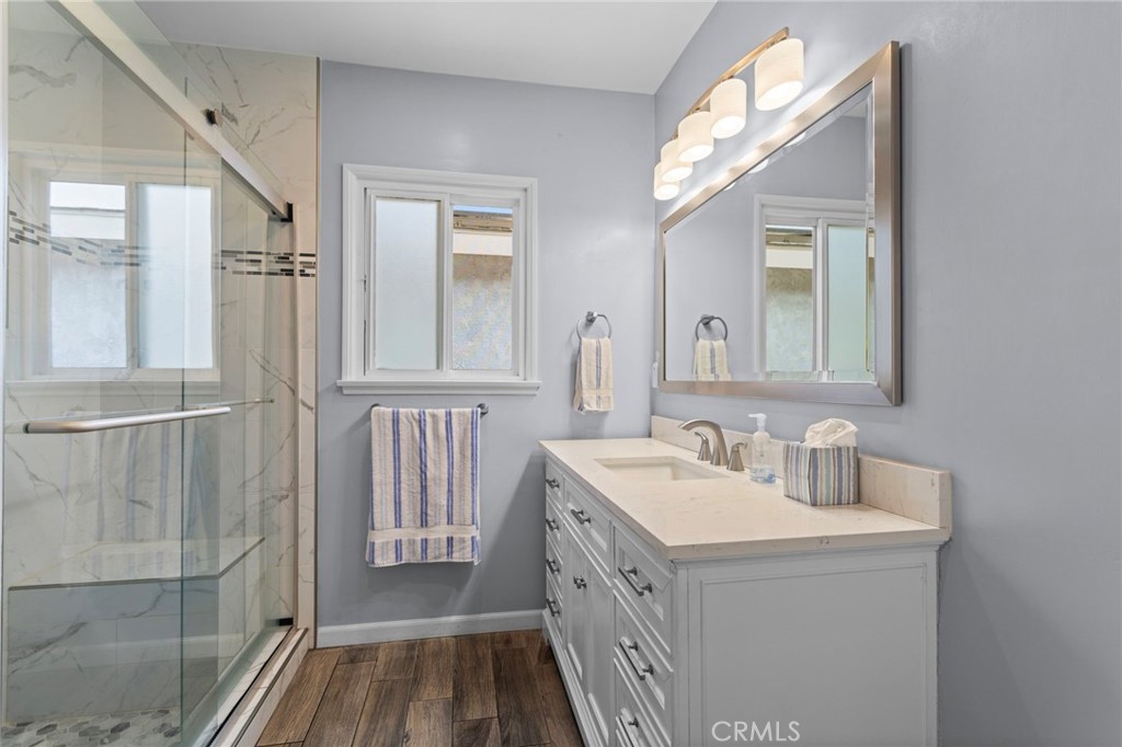 7508 Brookmill Road Downey, CA 90241 - Photo 22 of 29 a bathroom with a double vanity sink mirror and