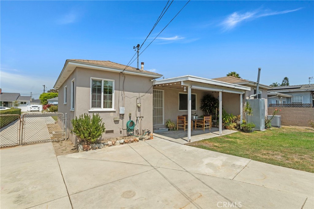 7508 Brookmill Road Downey, CA 90241 - Photo 24 of 29 a front view of a house with a garden