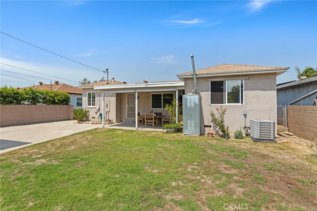 7508 Brookmill Road Downey, CA 90241 - Photo 26 of 29 a front view of a house with a yard patio and fire pit