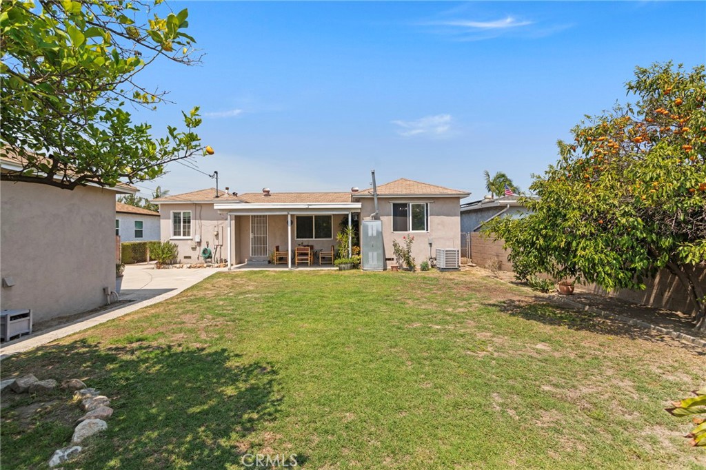 7508 Brookmill Road Downey, CA 90241 - Photo 27 of 29 a front view of a house with a garden