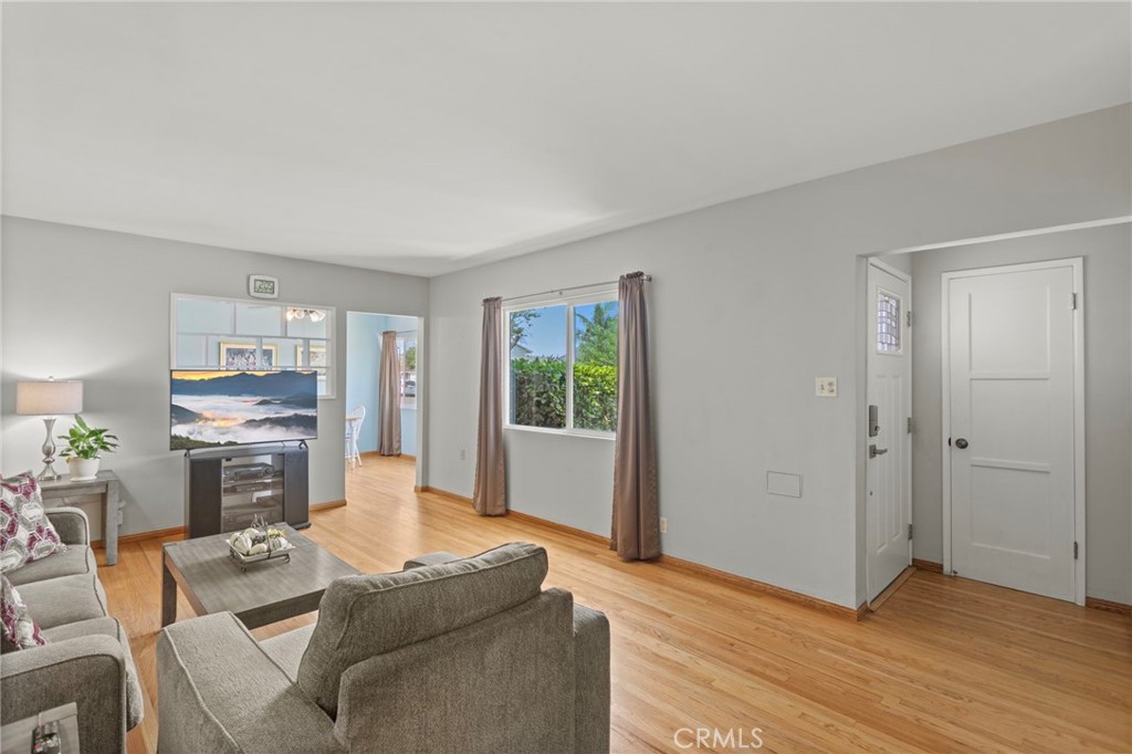 7508 Brookmill Road Downey, CA 90241 - Photo 6 of 29 a living room with furniture and a window