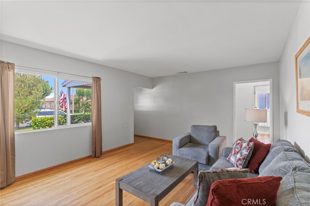 7508 Brookmill Road Downey, CA 90241 - Photo 8 of 29 a living room with furniture and a window